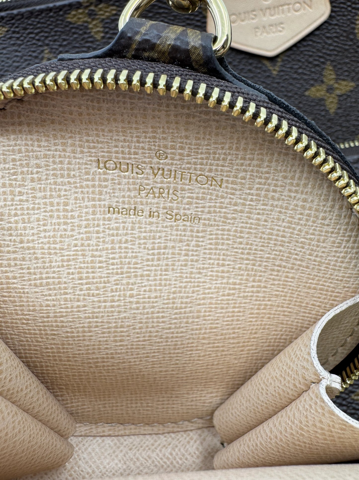 Interior-of-the-coin-case-of-the-Louis-Vuitton-Multi-Pochette-Accessoires-with-Louis-Vuitton-and-country-of-origin-Spain