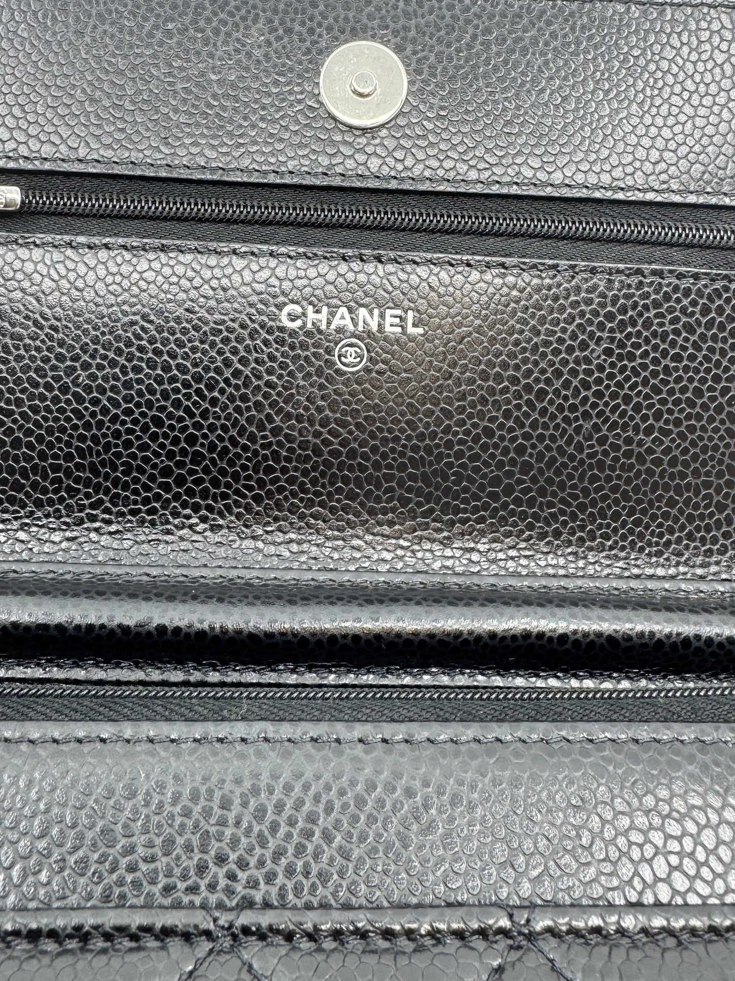 chanel-logo-written-in-silver-on-the-interior-of-the-chanel-wallet-on-chain-silver-bag-showcasing-authenticity