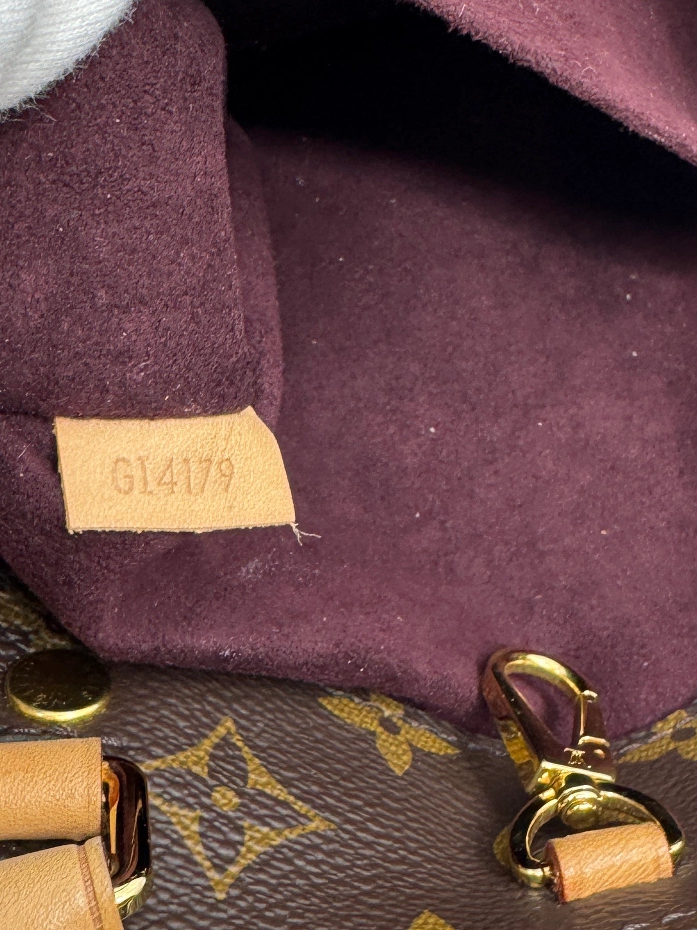 detail-of-vachetta-leather-tag-of-louis-vuitton-montaigne-bb-bag-with-serial-number