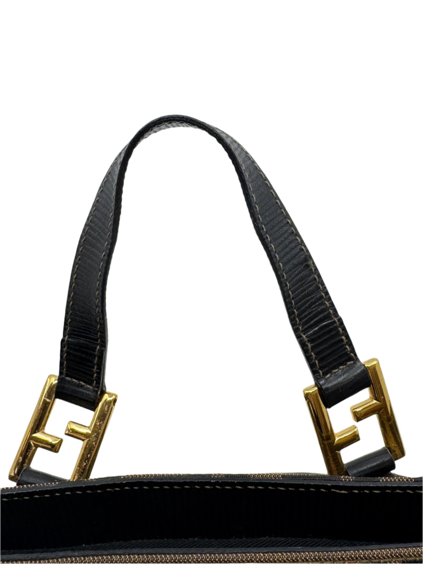 zoom-in-of-the-black-leather-handle-finishing-of-the-fendi-zucca-handbag-with-the-iconic-ff-logo-on-the-golden-buckle-connecting-the-handles