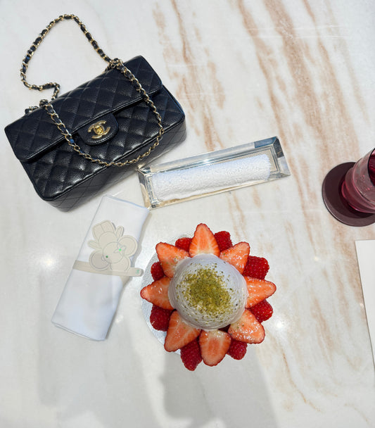 chanel-black-lambskin-leather-on-the-table-with-another-objets