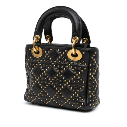 Back-panel-of-the-Mini-Lady-Dior-Black-Studded-Supple-Cannage-Calfskin-with-gold-tone-details-and-CD-engraved-on-the-handle-rings