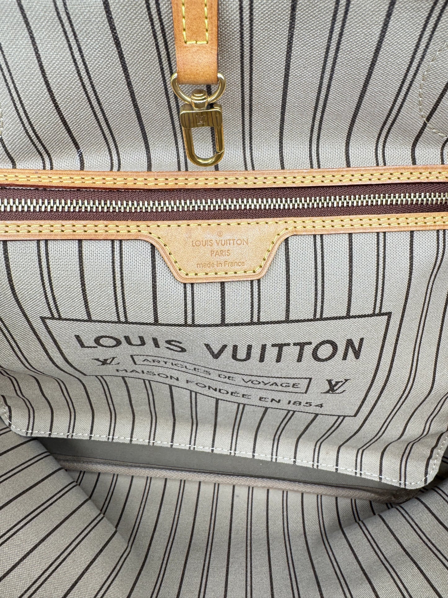 Detail-of-the-Louis-Vuitton-tag-showing-authenticity-of-the-bag-and-country-of-manufacture