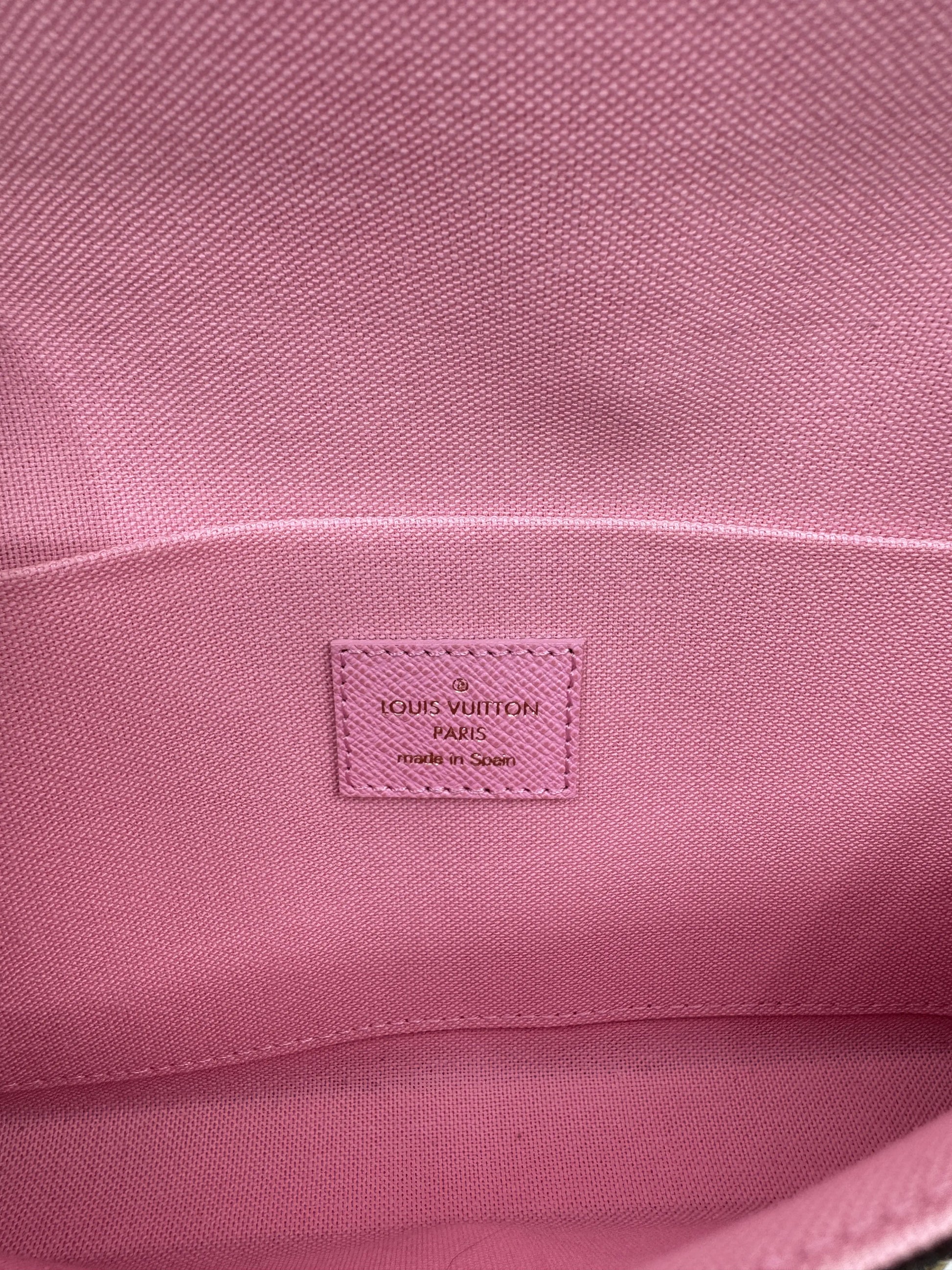 Pink-interior-tag-of-Louis-Vuitton-Felicie-Pochette-with-Louis-Vuitton-authenticity-registration-and-made-in-Spain