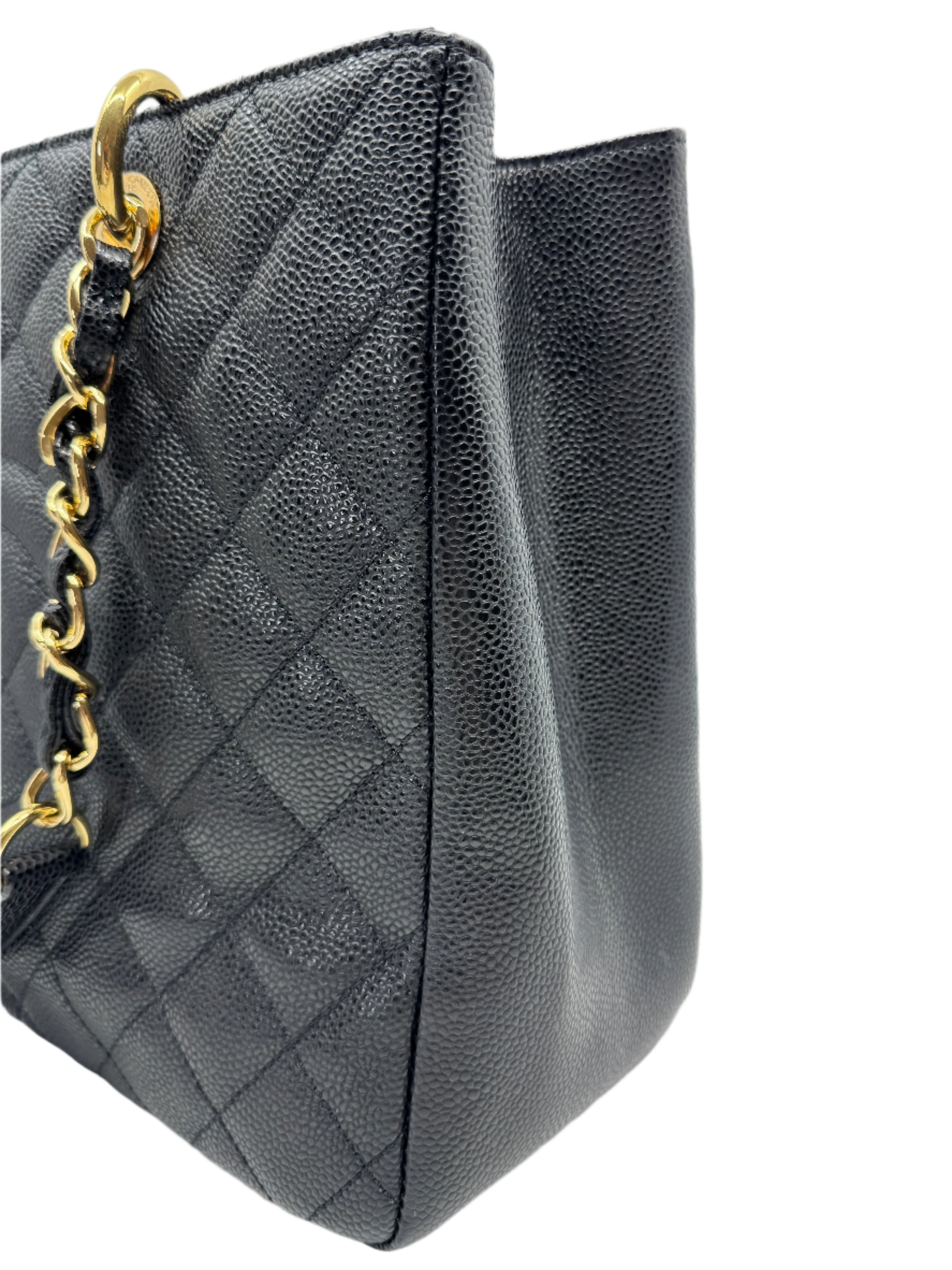 detail-of-finishing-on-right-side-of-chanel-black-caviar-grand-shopping-tote